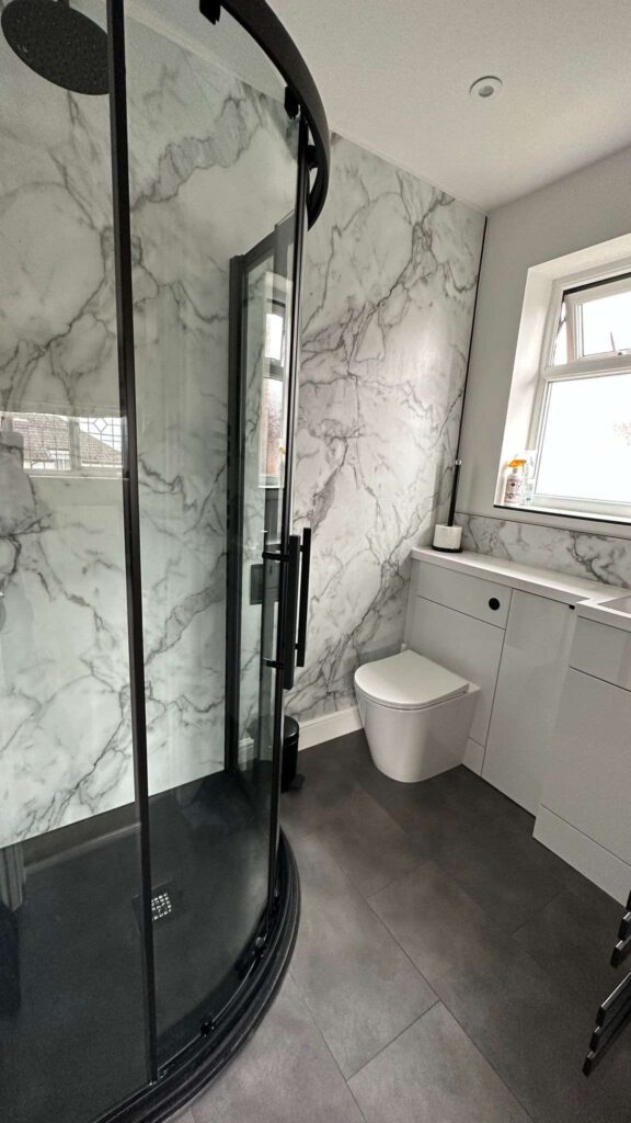 Modern looking walk in corner shower, nice and spacious